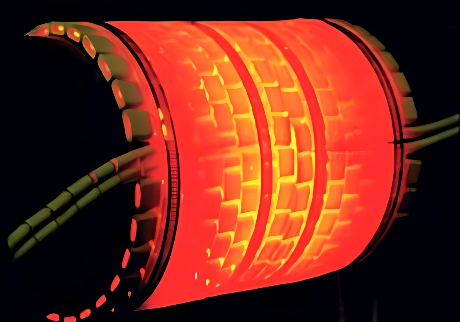 Glowing red cylindrical structure in darkness.